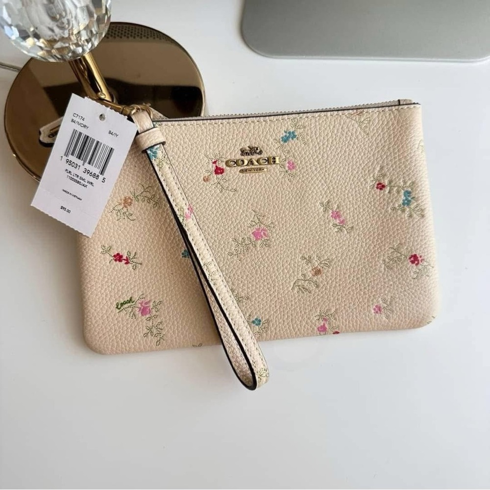 Coach leather zip top wristlet Antique floral print